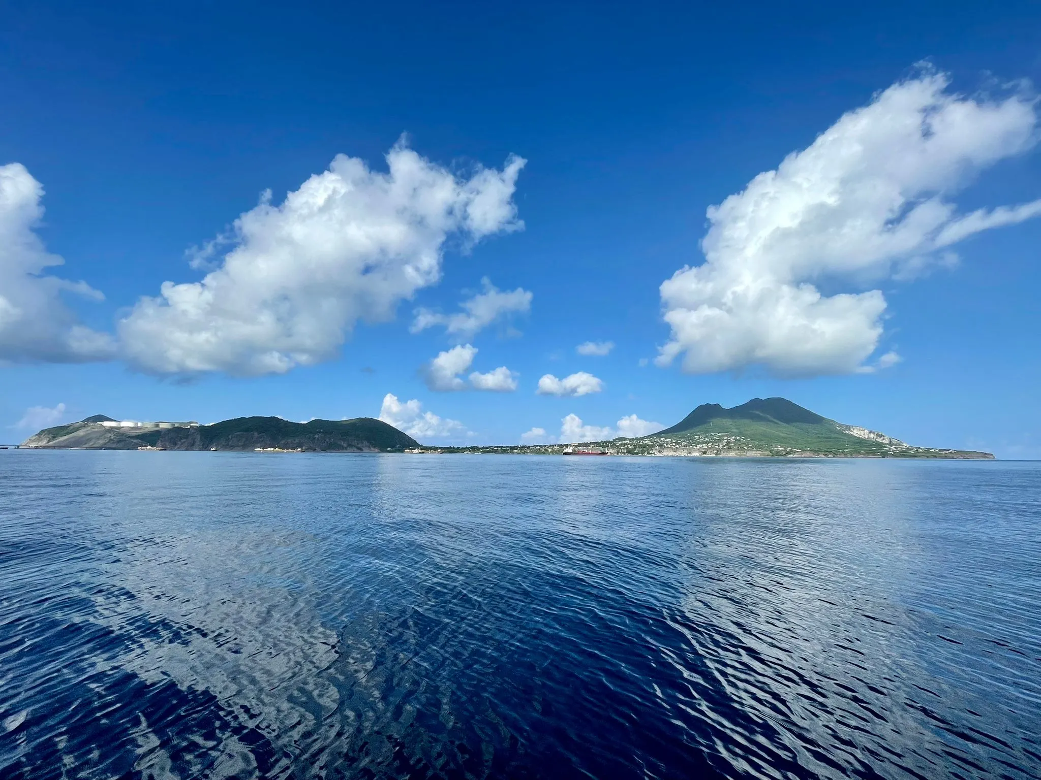 St. Eustatius seen from the water, the Quill rising above Oranjestad on the island's green ridge